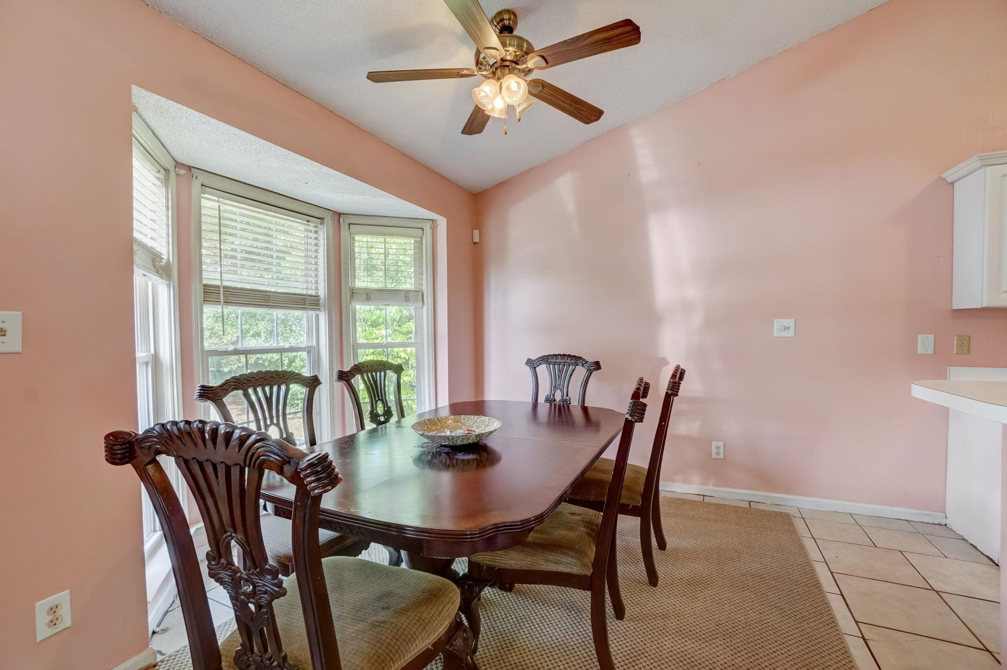 7133 Spanglers Spring Way Raleigh, NC 27610 - Photo 6 of 17 a view of a dining room with furniture window and outside view