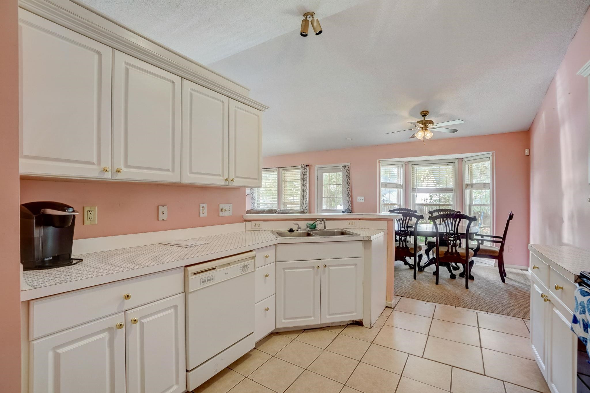 7133 Spanglers Spring Way Raleigh, NC 27610 - Photo 8 of 17 a kitchen with cabinets and chairs