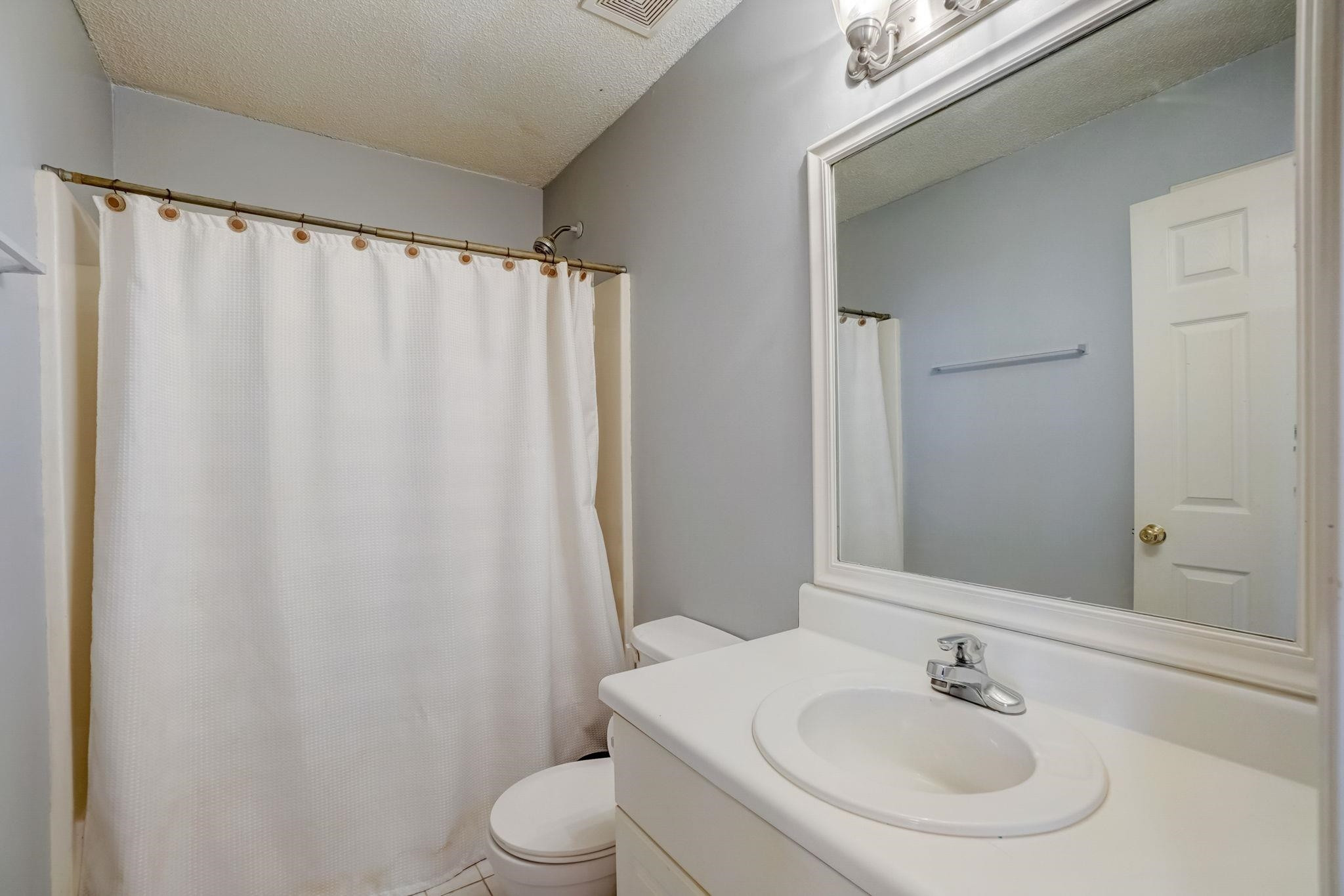 7133 Spanglers Spring Way Raleigh, NC 27610 - Photo 10 of 17 a bathroom with a sink and a mirror