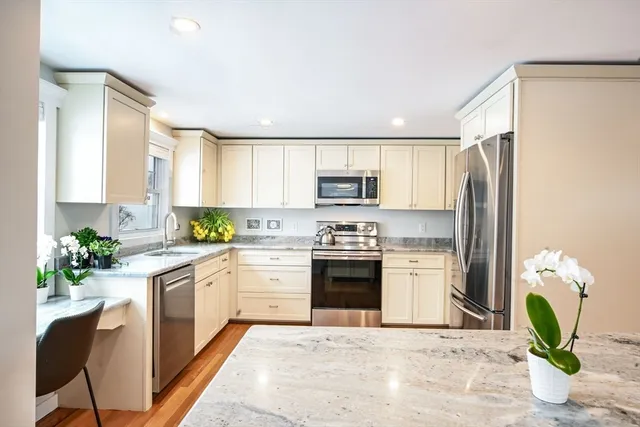 a kitchen with a sink stove and refrigerator