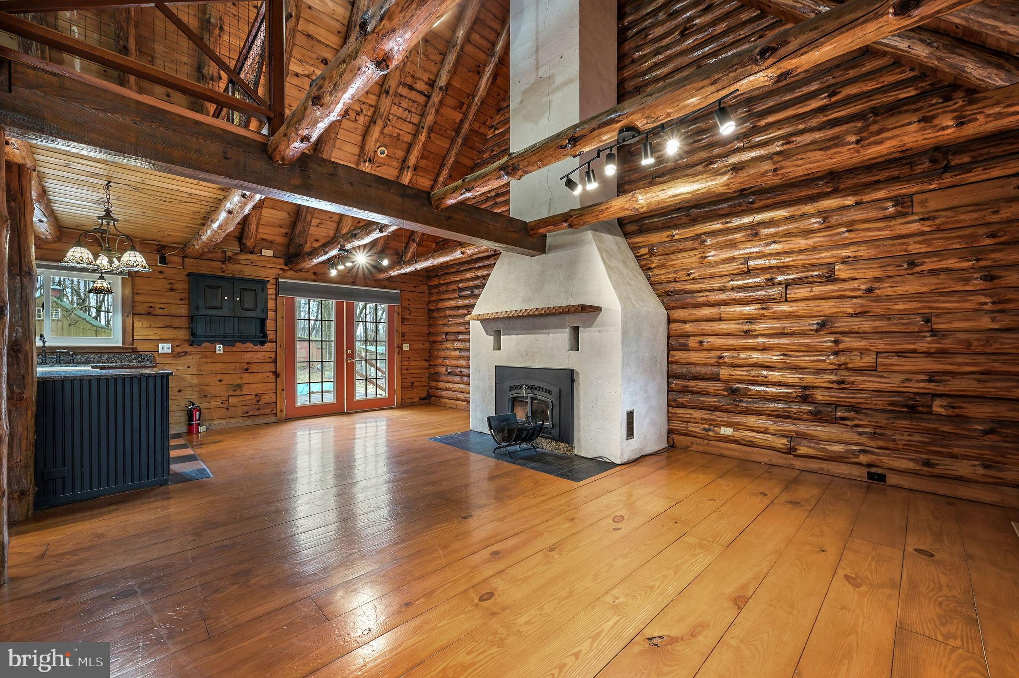 334 Sophers Row Magnolia, DE 19962 - Photo 18 of 47 a view of an empty room with wooden floor and a fireplace