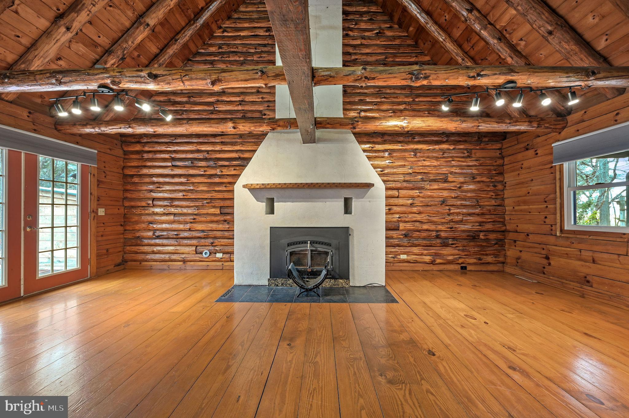 334 Sophers Row Magnolia, DE 19962 - Photo 20 of 47 a view of an empty room with wooden floor and a fireplace