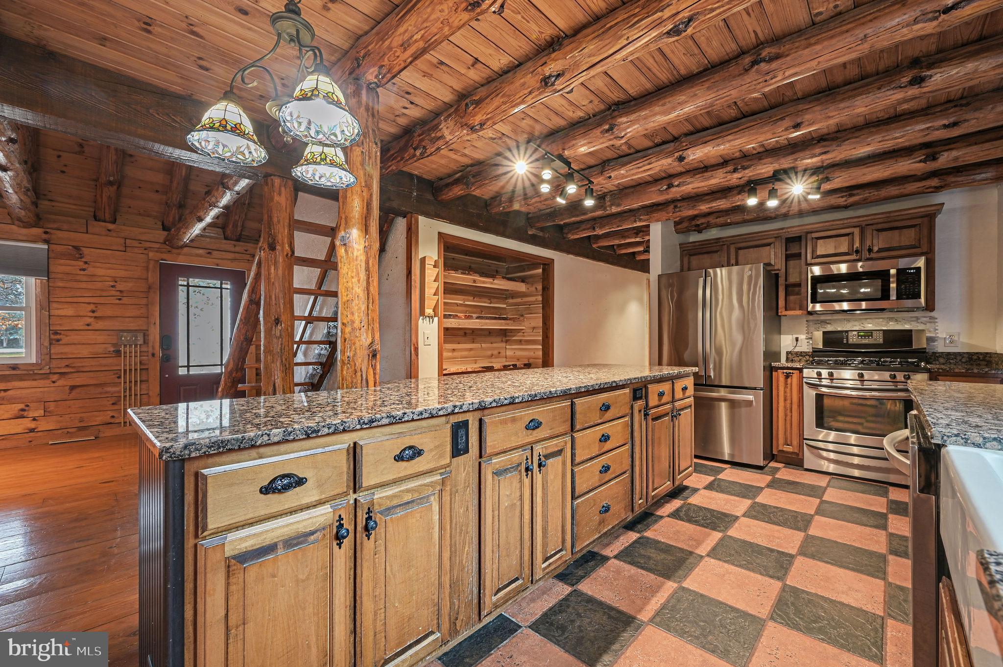 334 Sophers Row Magnolia, DE 19962 - Photo 26 of 47 a kitchen with stainless steel appliances granite countertop a sink stove and cabinets