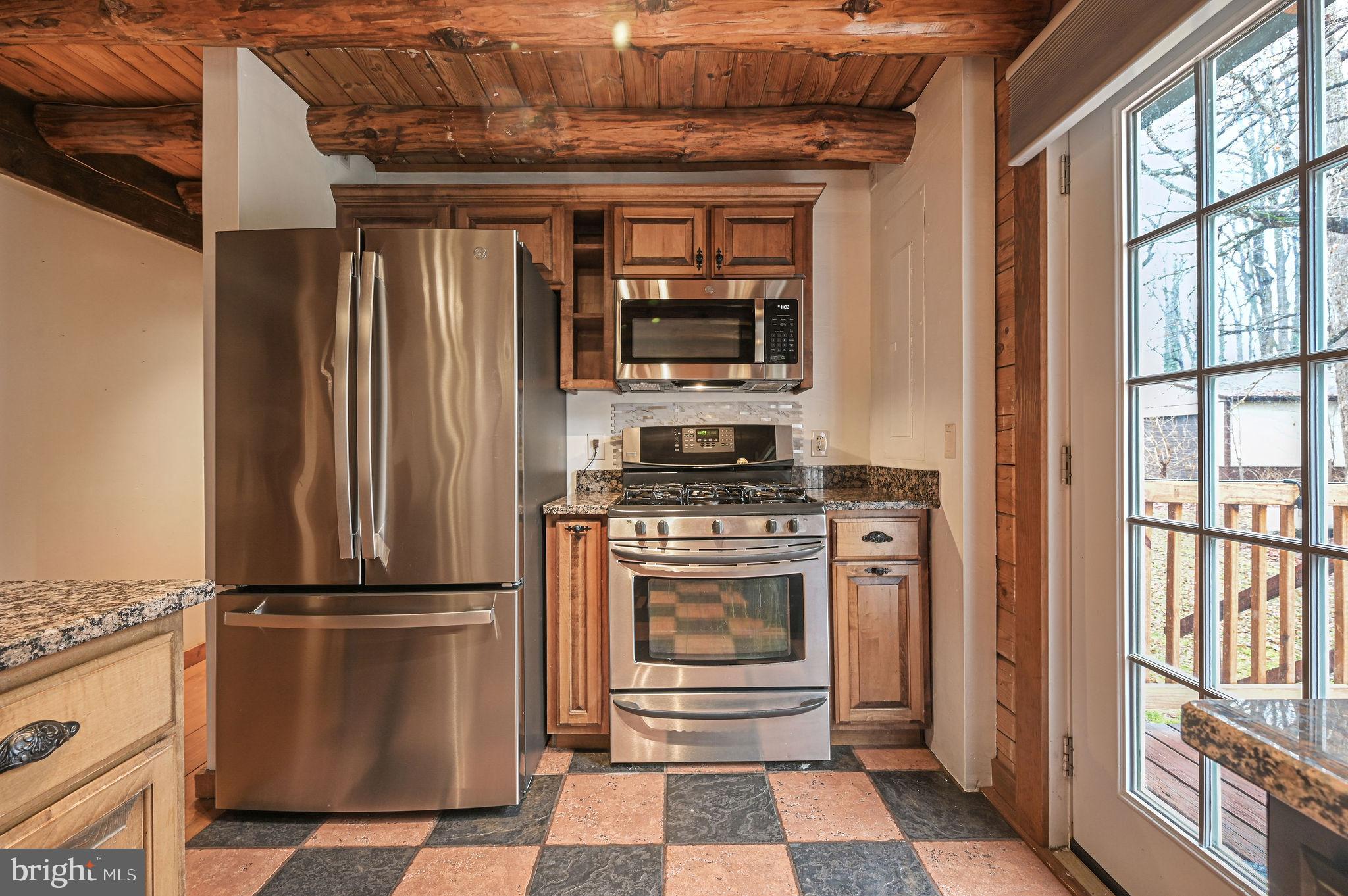 334 Sophers Row Magnolia, DE 19962 - Photo 27 of 47 a kitchen with a refrigerator and a stove top oven