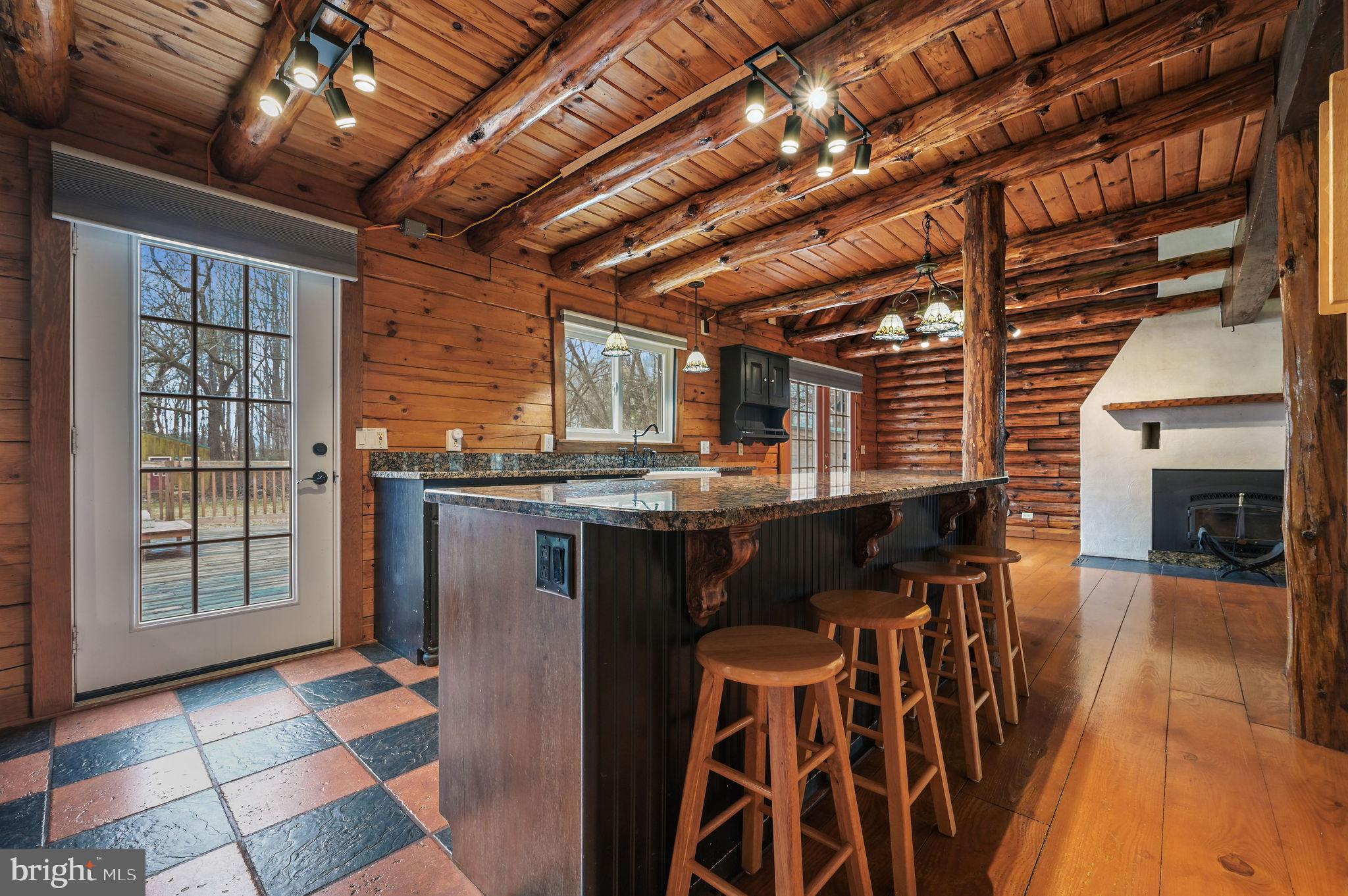 334 Sophers Row Magnolia, DE 19962 - Photo 30 of 47 a kitchen with stainless steel appliances granite countertop a stove and a refrigerator