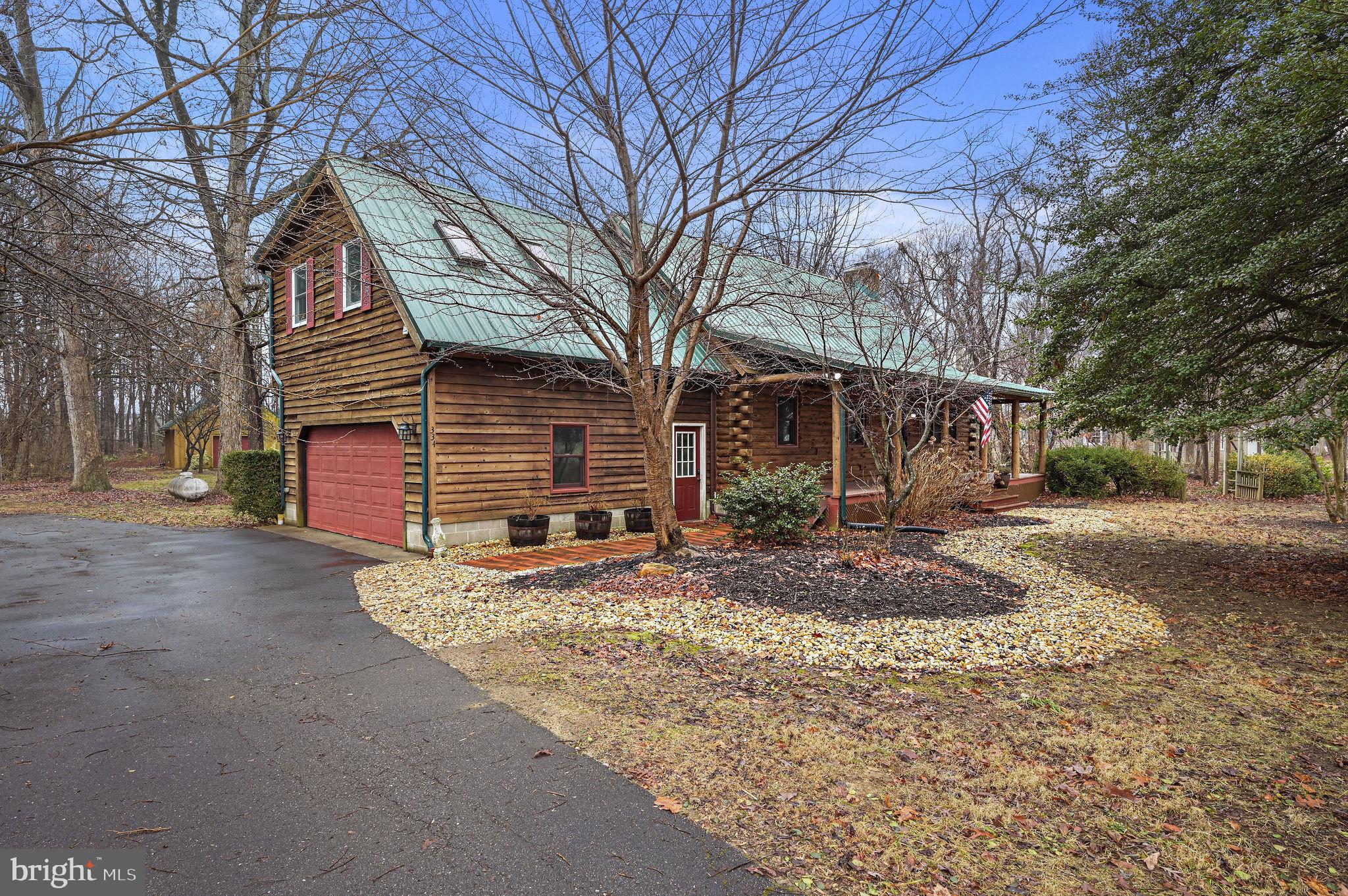 334 Sophers Row Magnolia, DE 19962 - Photo 3 of 47 a view of a house with a yard covered in snow