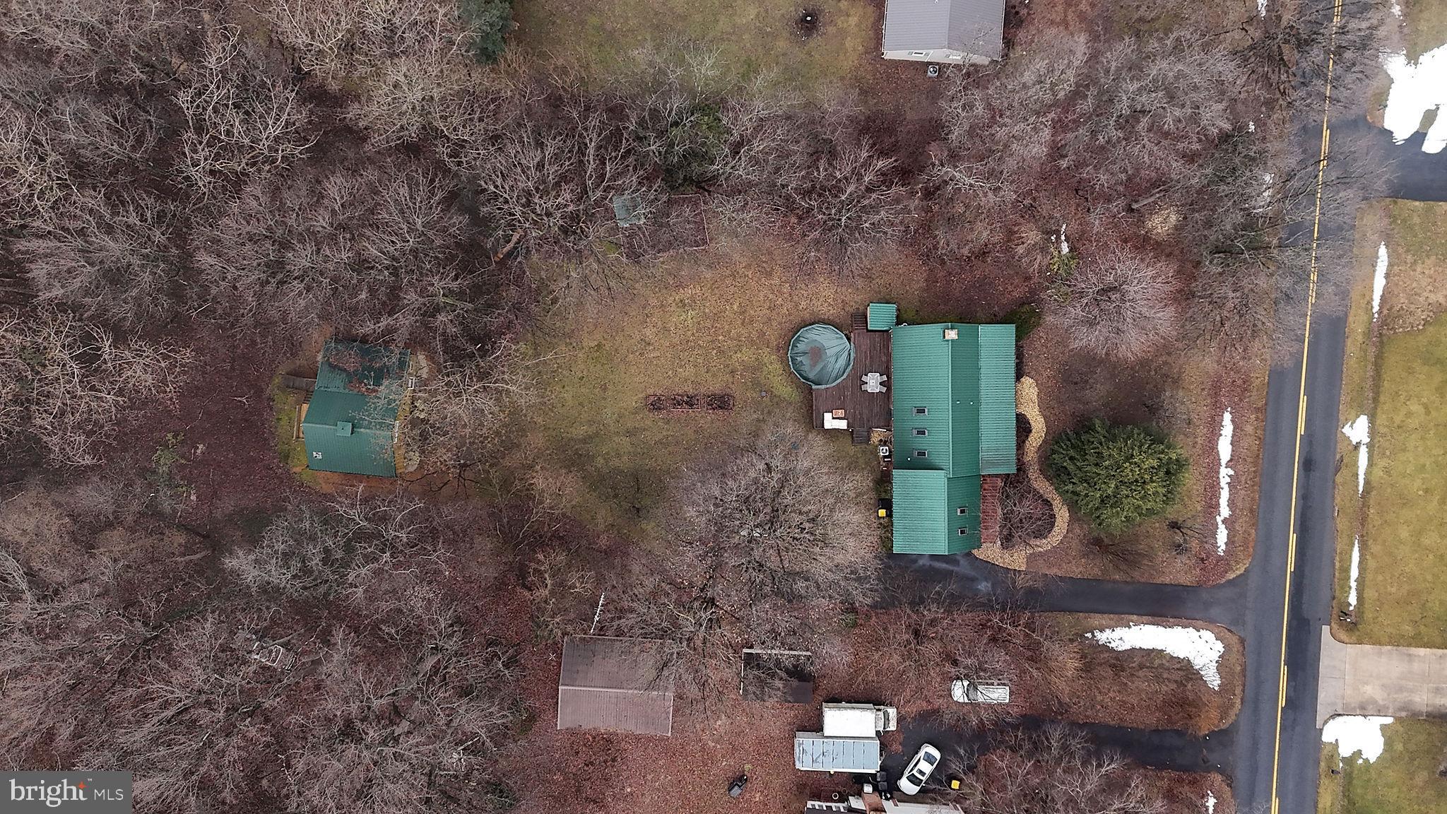 334 Sophers Row Magnolia, DE 19962 - Photo 47 of 47 a green building with trees in front of it