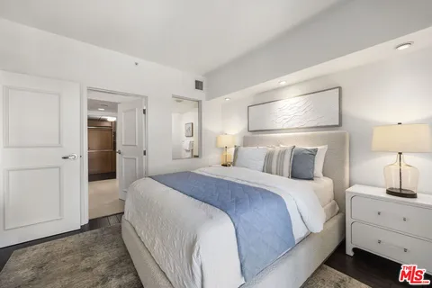 a bathroom with a tub a sink and mirrors