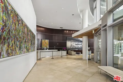 an aerial view of residential building and ocean view