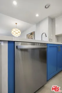 a stove top oven sitting inside of a kitchen
