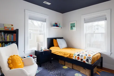 a bedroom with bed and window