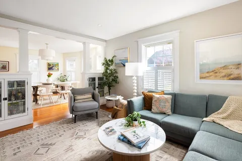 a living room with furniture and a table