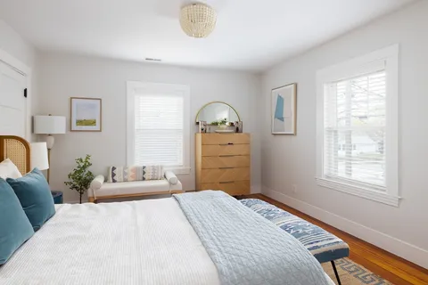 a bedroom with a bed and a dresser