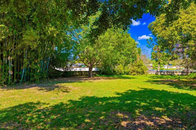 a view of swimming pool and outdoor seating