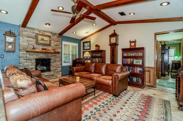 a living room with furniture and a fireplace