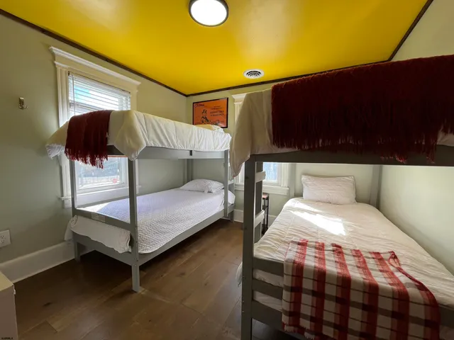 a bedroom with a bed and lamp