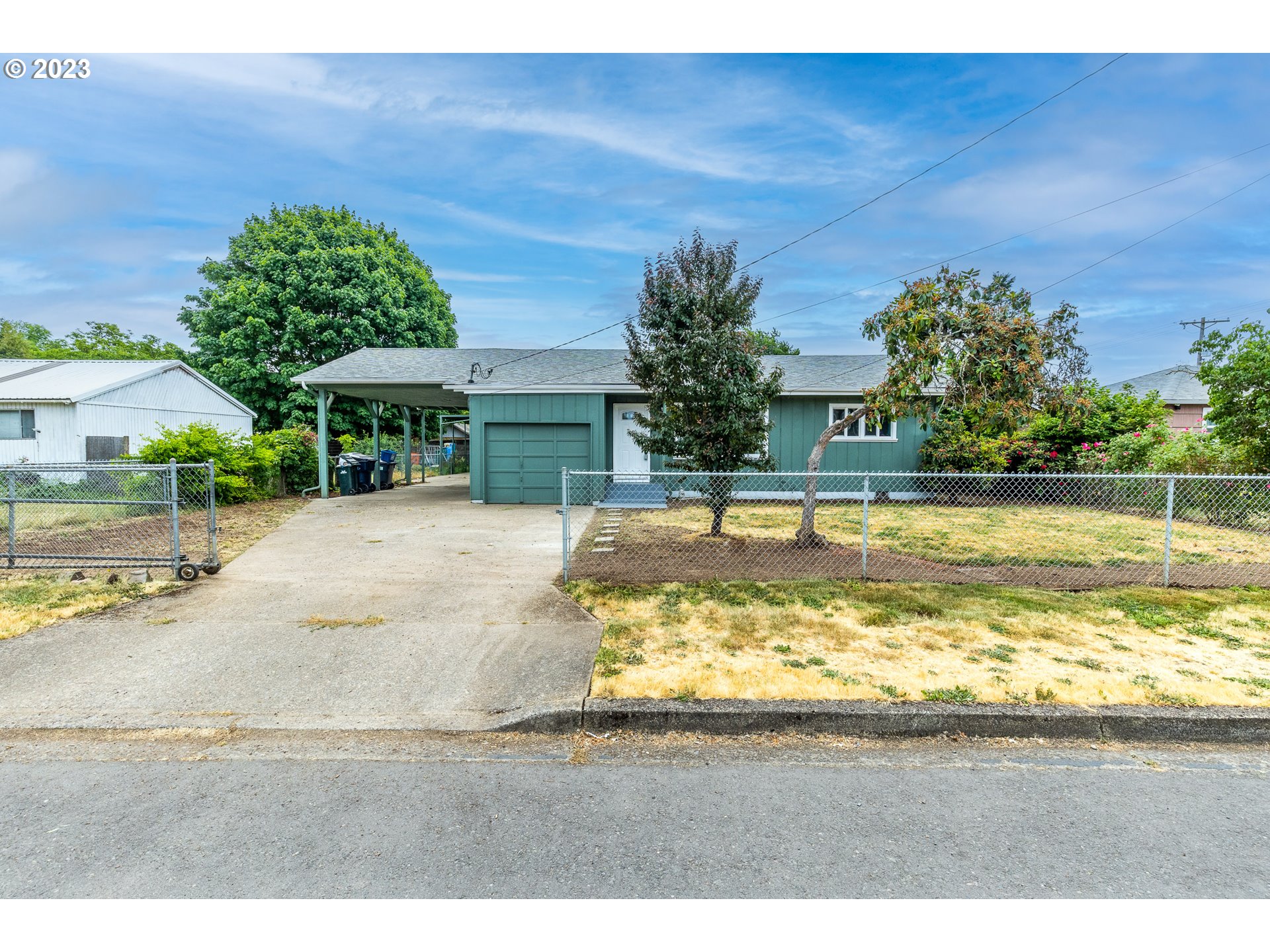 5119 E Street Springfield, OR 97478 - Photo 1 of 28 a swimming pool with outdoor seating and yard