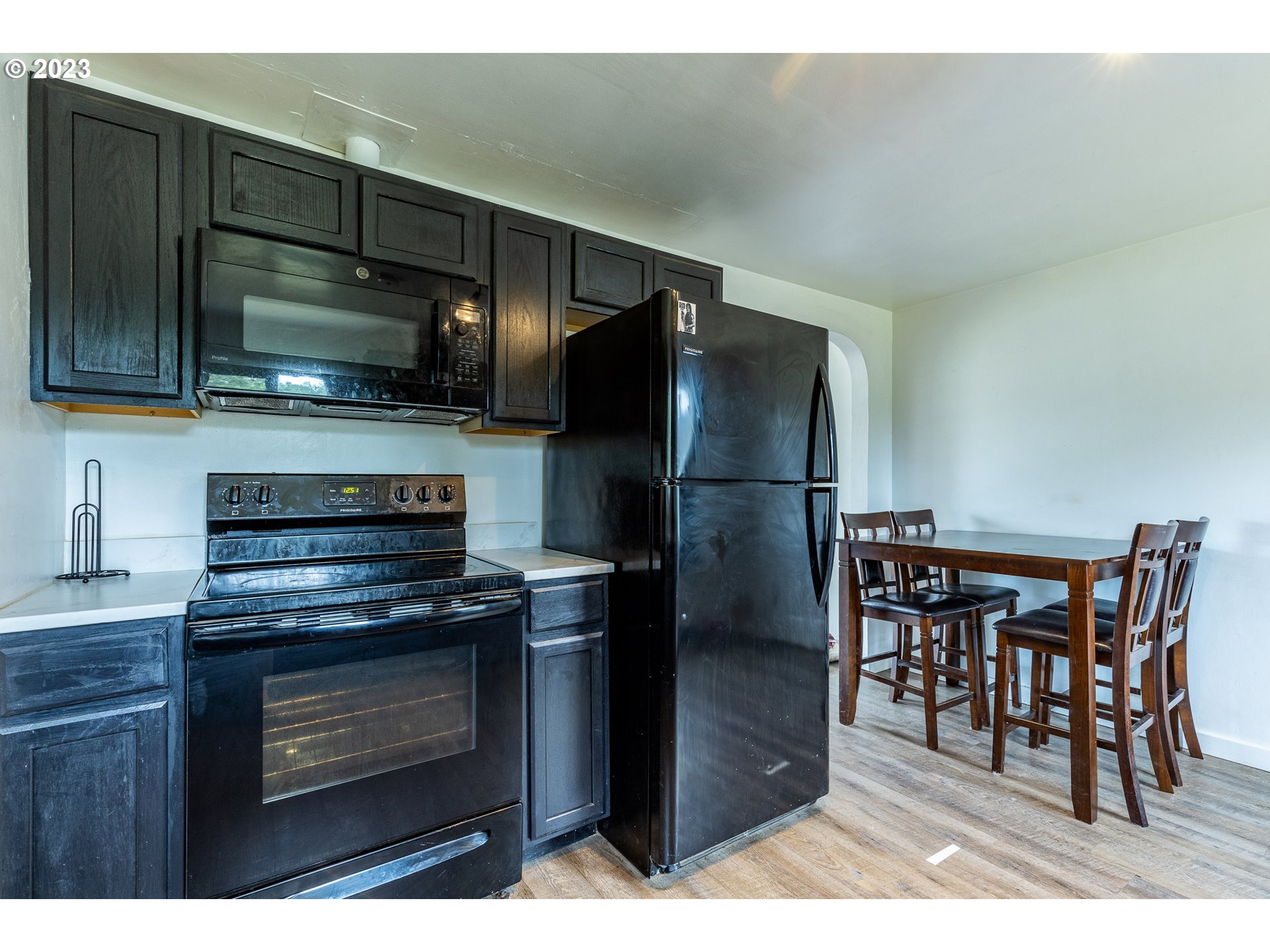 5119 E Street Springfield, OR 97478 - Photo 14 of 28 a kitchen with a refrigerator stove and microwave
