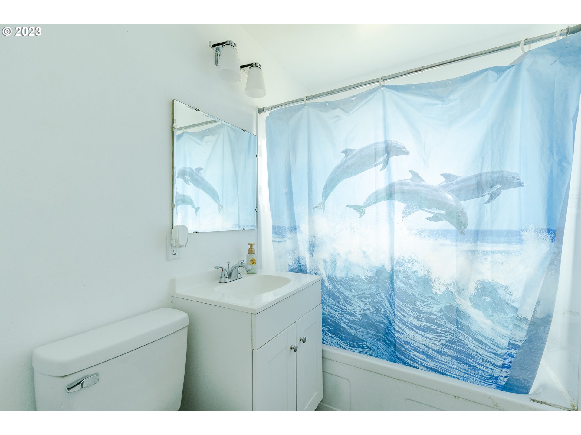 5119 E Street Springfield, OR 97478 - Photo 16 of 28 a bathroom with a shower sink and mirror