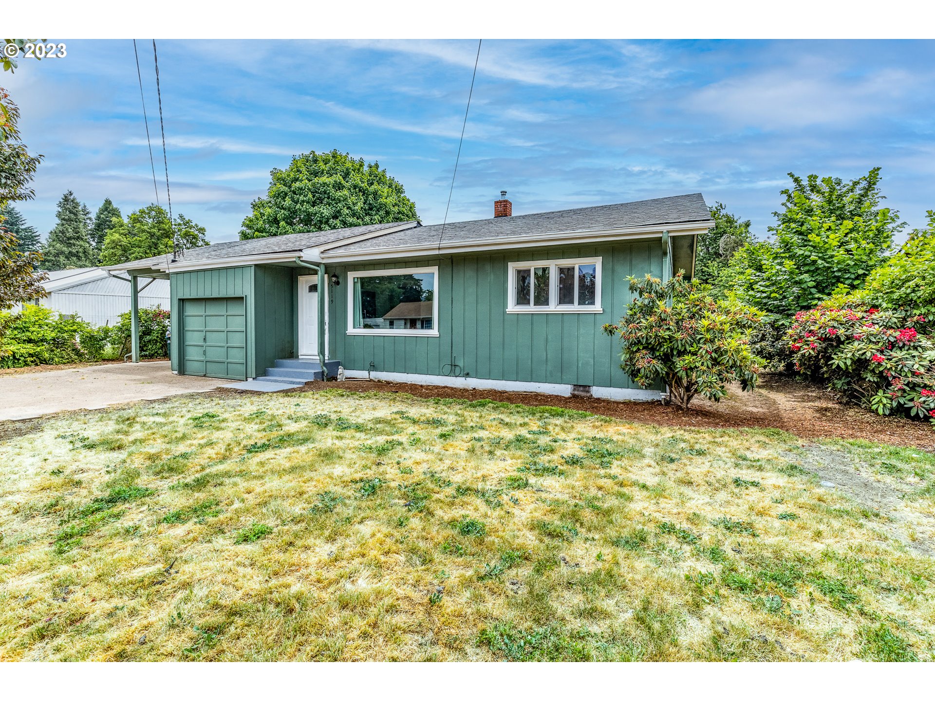 5119 E Street Springfield, OR 97478 - Photo 3 of 28 a view of a house with potted plants
