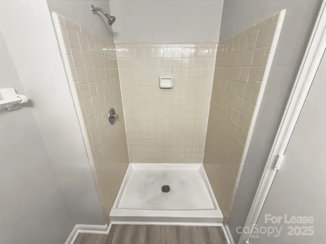 a view of storage and utility room with empty racks