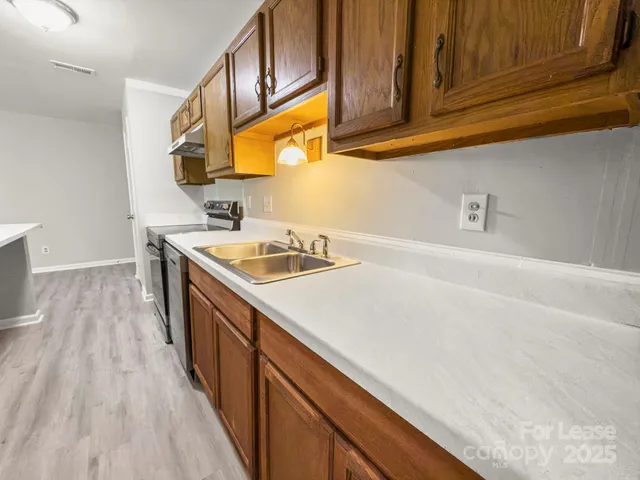 a view of living room with furniture and a mirror