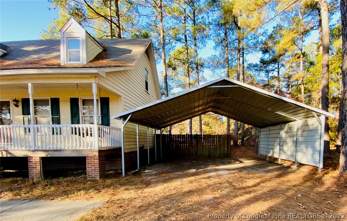 90 Cypress Road Cameron, NC 28326 - Photo 2 of 22 a view of a house with a yard
