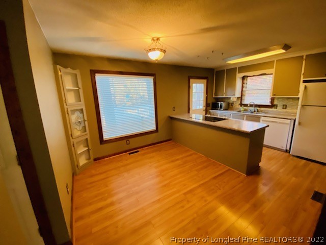 90 Cypress Road Cameron, NC 28326 - Photo 9 of 22 a kitchen with stainless steel appliances granite countertop a sink stove and refrigerator