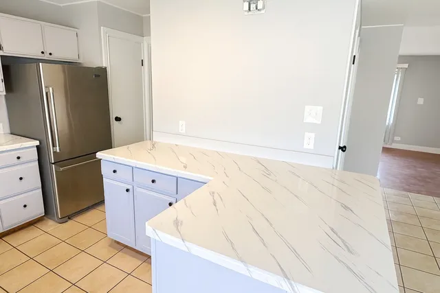 a bathroom with a bathtub sink and mirror