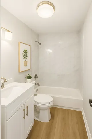 a bathroom with a sink a toilet and a bathtub