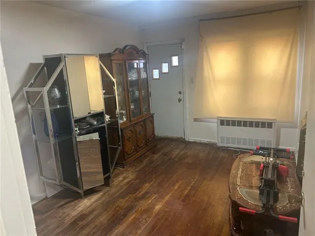 a view of a livingroom with furniture and a window