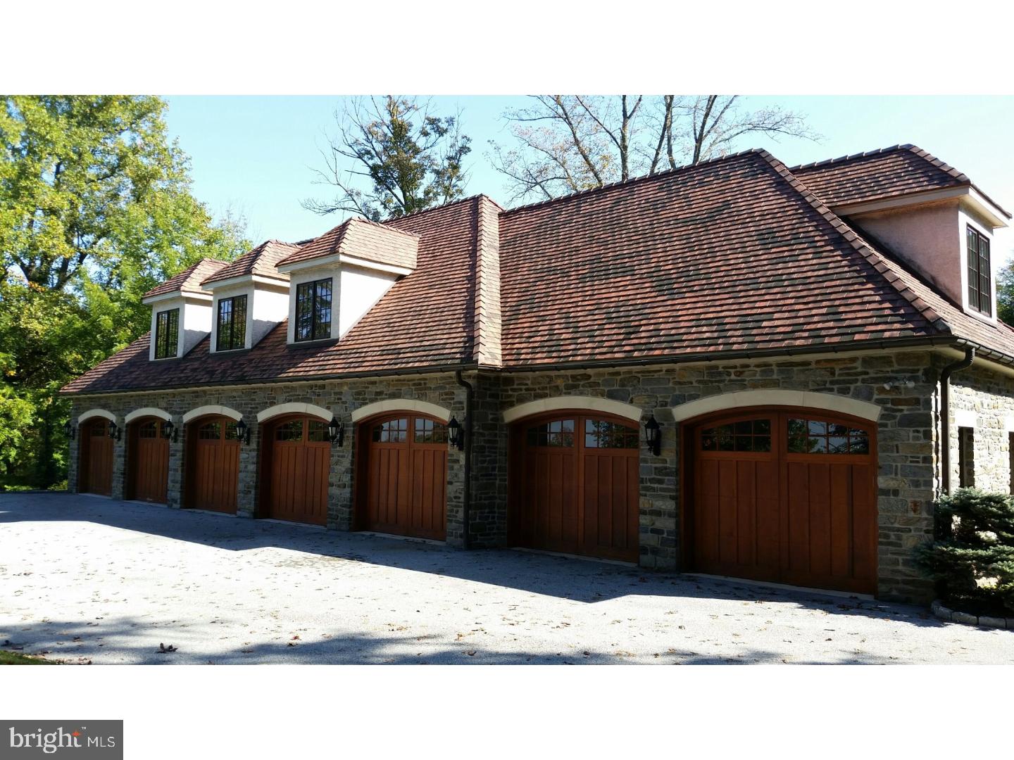 1653 Mt Pleasant Road Villanova, PA 19085 - Photo 2 of 16 a black and white building with black door