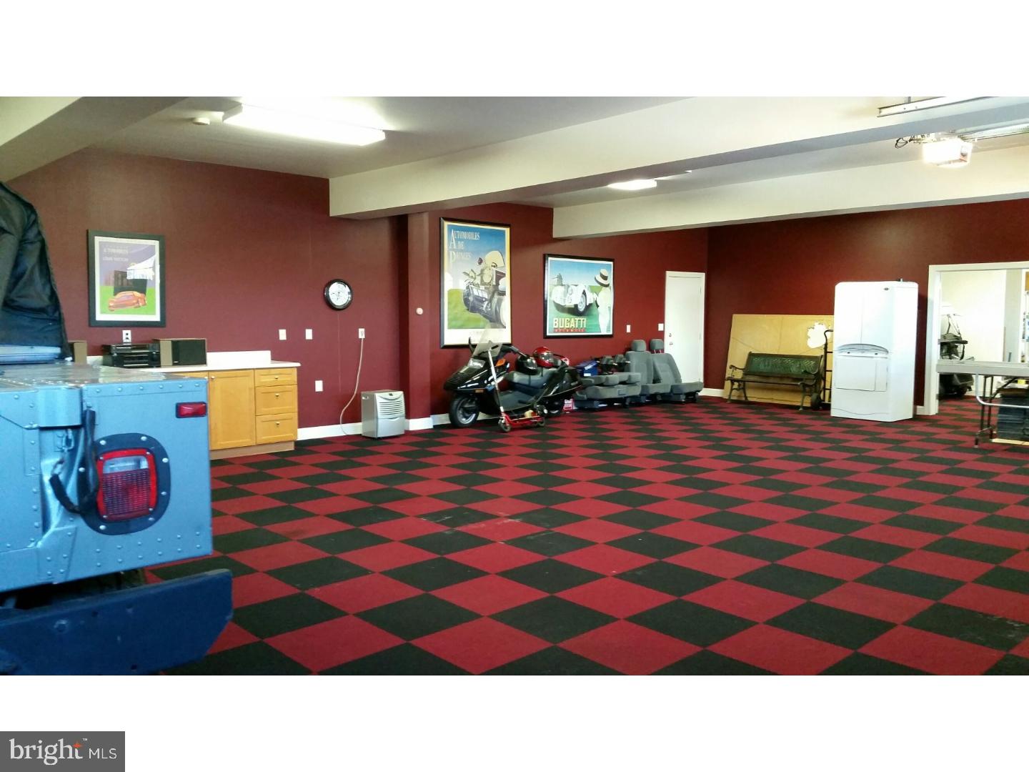 1653 Mt Pleasant Road Villanova, PA 19085 - Photo 12 of 16 a living room with furniture and a flat screen tv