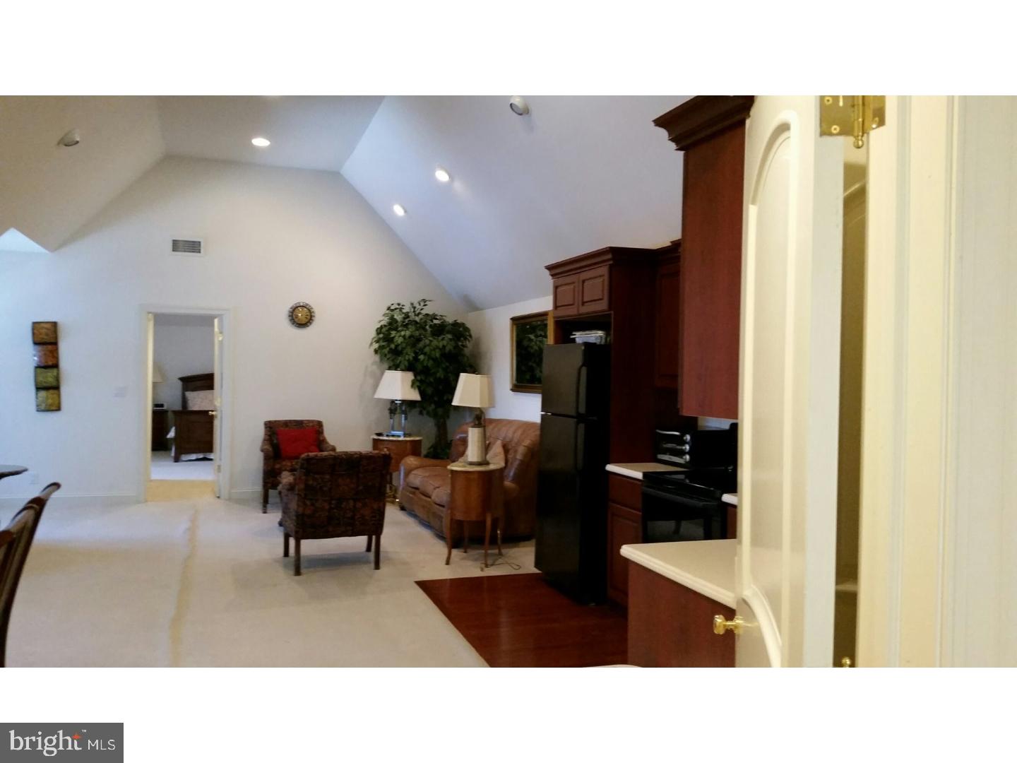 1653 Mt Pleasant Road Villanova, PA 19085 - Photo 7 of 16 a living room with furniture and a flat screen tv