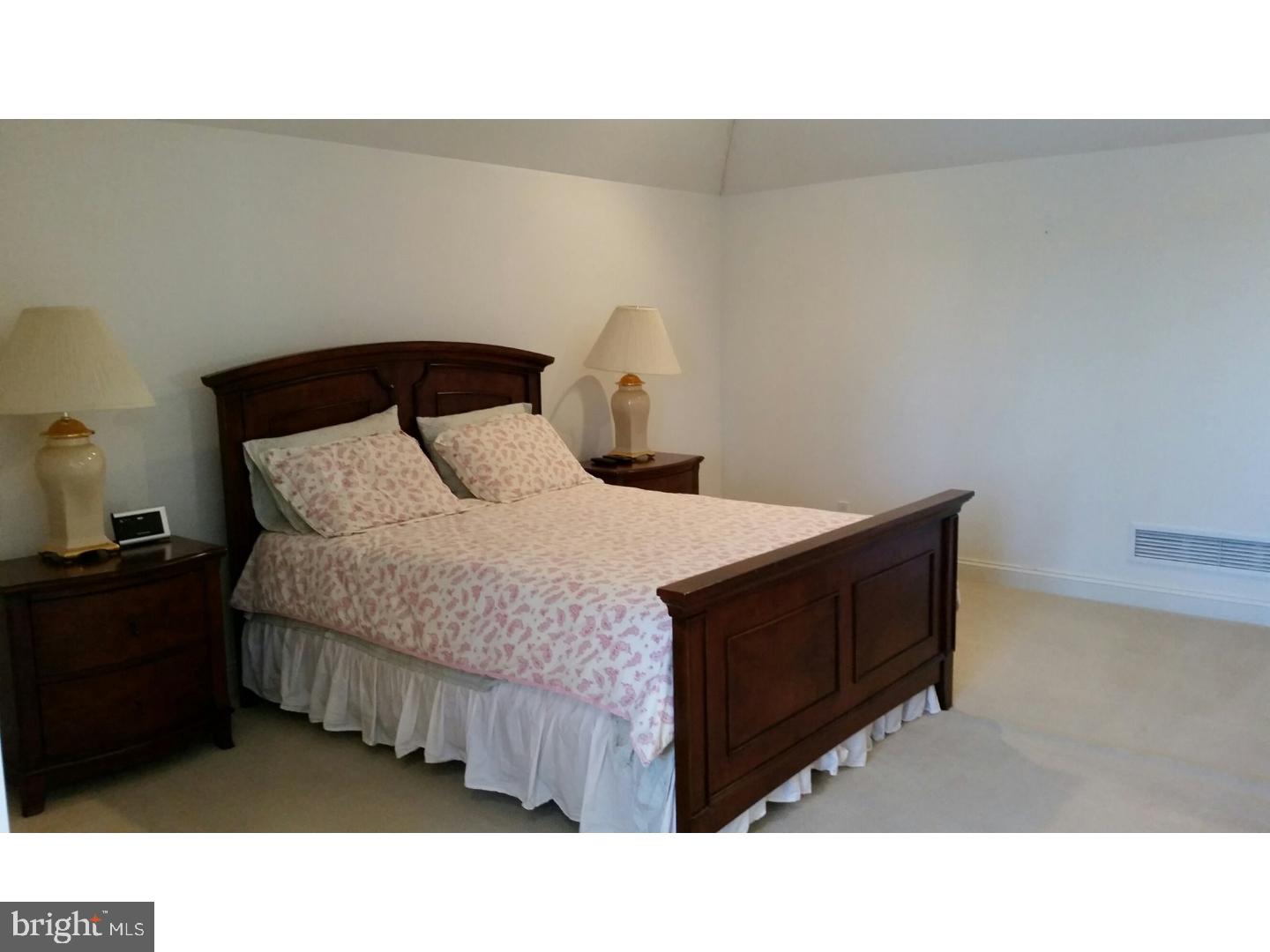 1653 Mt Pleasant Road Villanova, PA 19085 - Photo 9 of 16 a bed room with a bed and a night stand