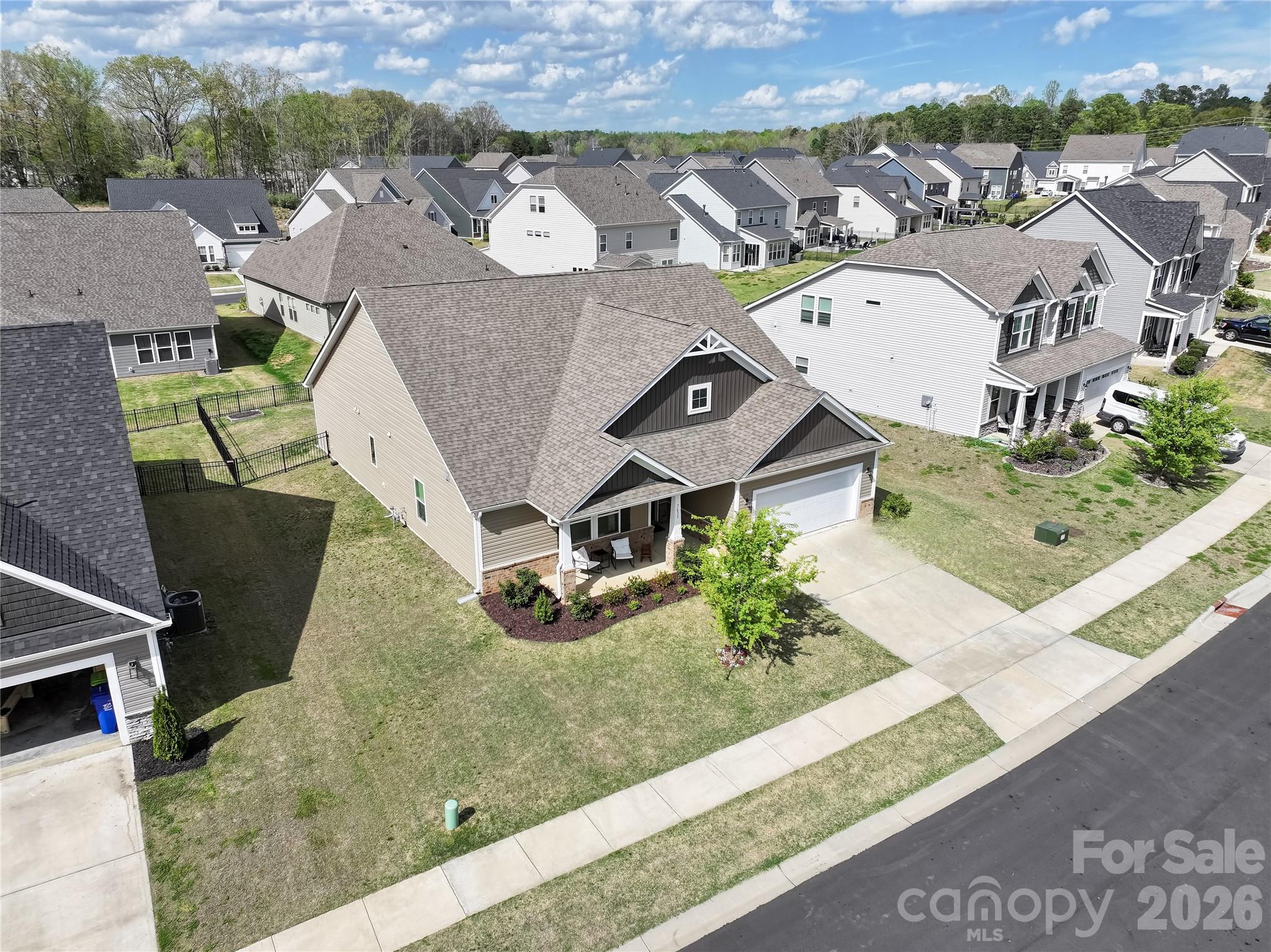 7633 Tanglewood Way Denver, NC 28037 - Photo 3 of 4 an aerial view of a house with garden space and street view