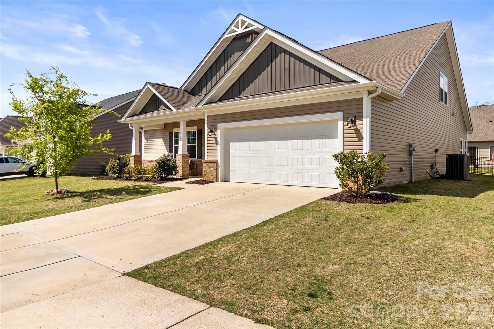 7633 Tanglewood Way Denver, NC 28037 - Photo 4 of 4 a front view of a house with a yard