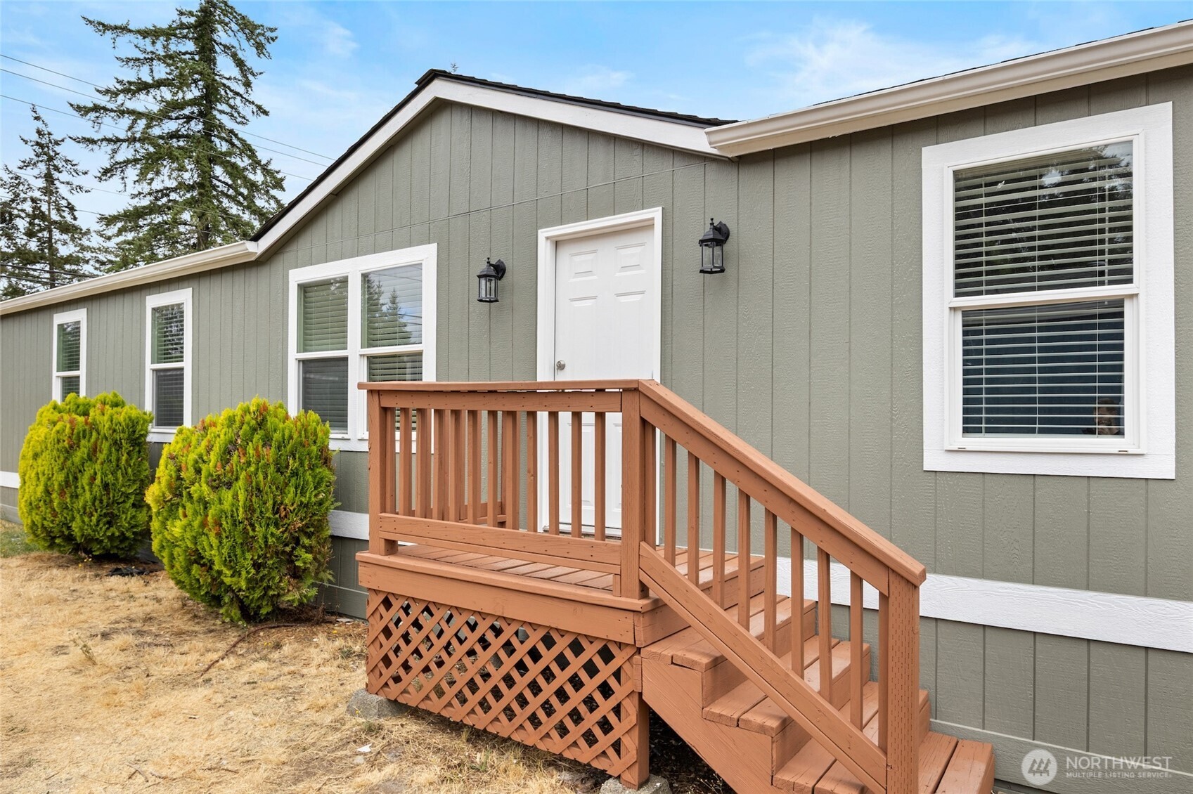 10324 Delphi Road Southwest, Unit 14 Olympia, WA 98512 - Photo 2 of 25 a view of a house with wooden floor roof deck