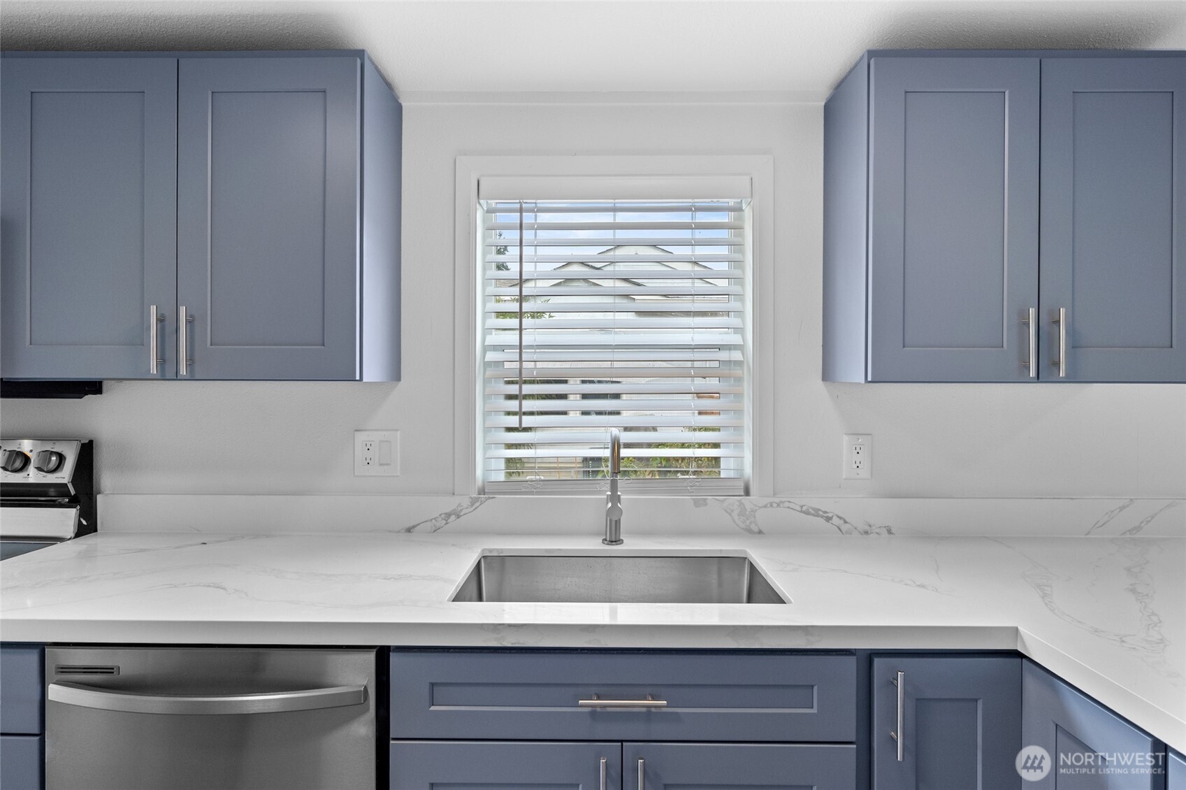 10324 Delphi Road Southwest, Unit 14 Olympia, WA 98512 - Photo 7 of 25 a kitchen with a sink and cabinets