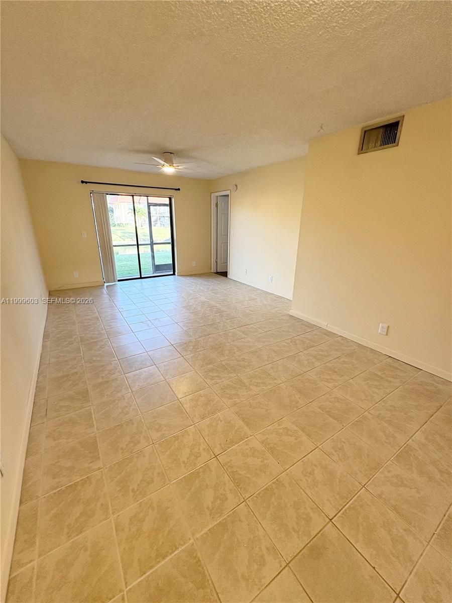 21904 Lake Forest Circle, Unit 203 Boca Raton, FL 33433 - Photo 3 of 11 a view of an empty room with a window