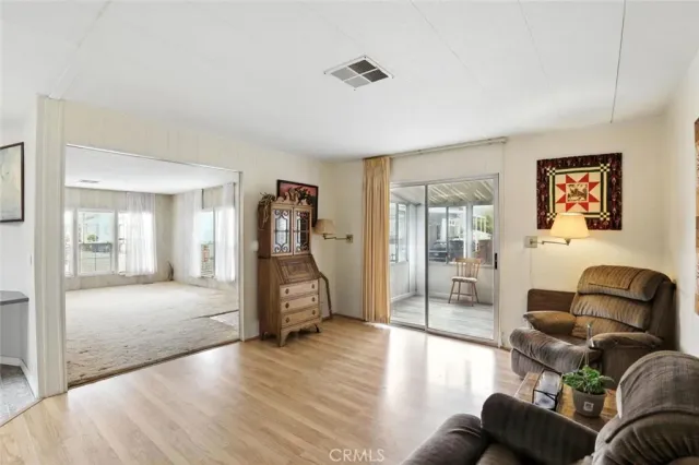 a large bathroom with a large mirror vanity and a shower