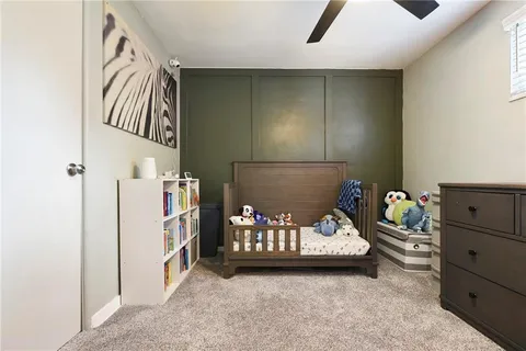 a bedroom with a bed and a cabinet