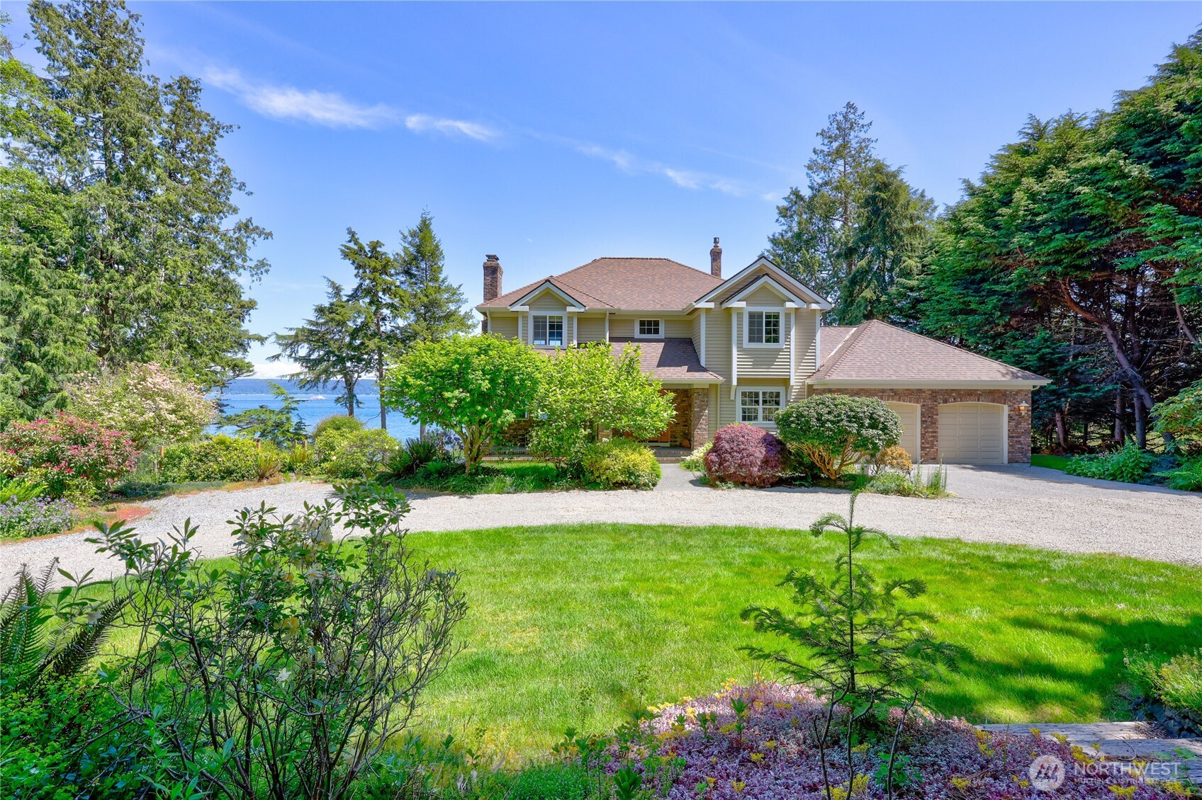 252 Jansen Road Nordland, WA 98358 - Photo 3 of 40 a view of a house with a yard and garden