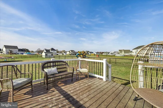 a view of a garden with a bench in the back yard