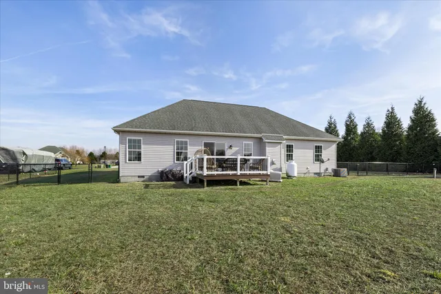 a front view of a house with a garden and porch