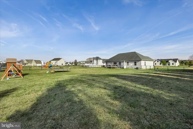 an aerial view of a house with big yard