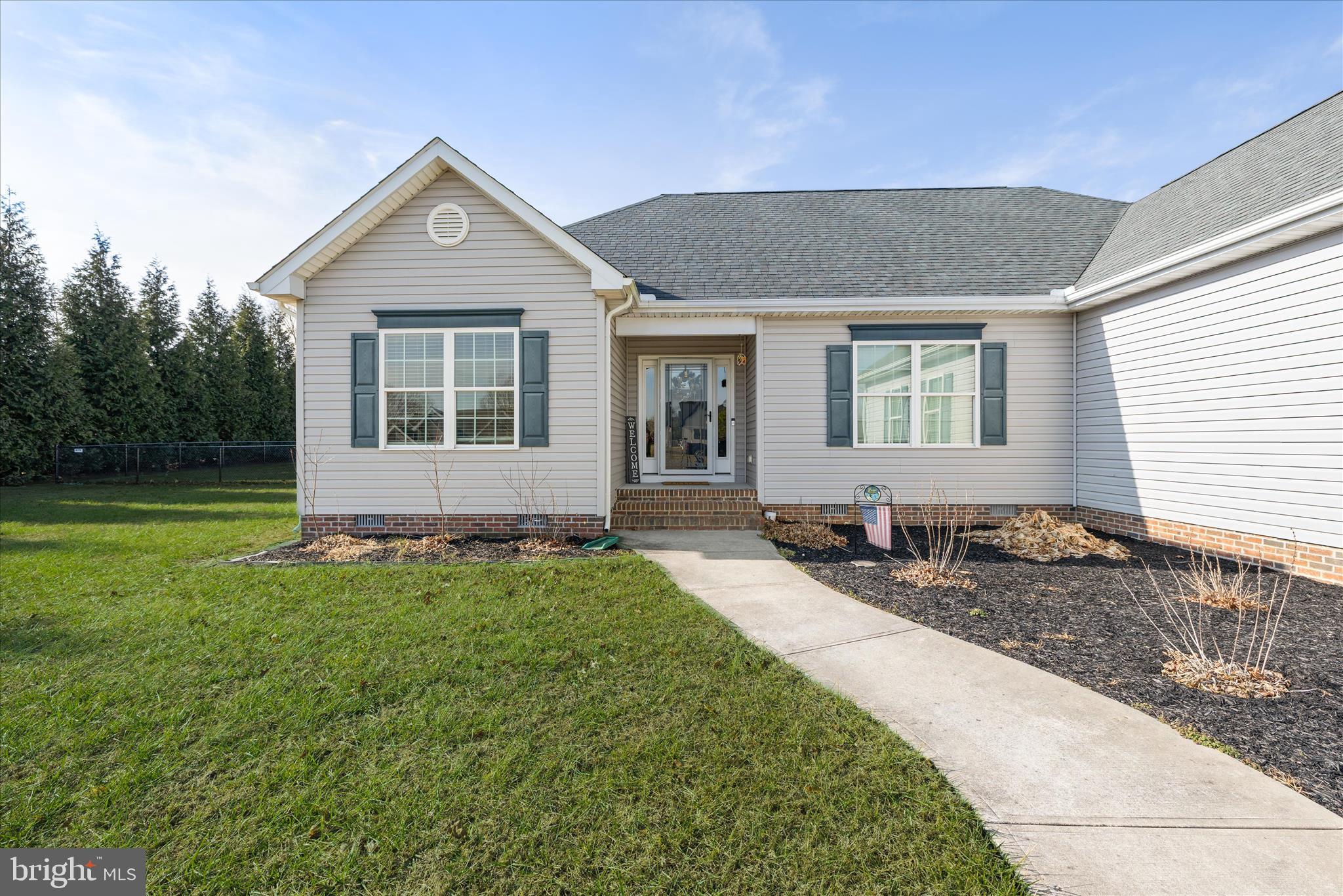 36831 Red Berry Road Delmar, DE 19940 - Photo 4 of 46 a front view of a house with a yard
