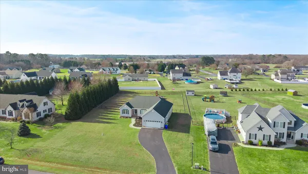 a aerial view of a house with a yard
