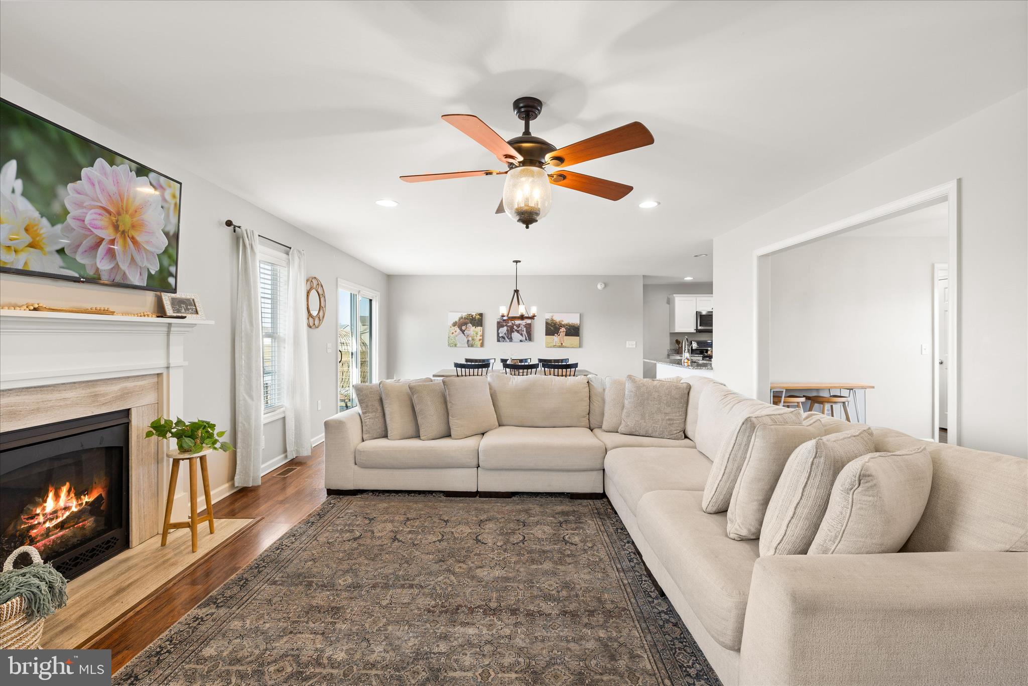 36831 Red Berry Road Delmar, DE 19940 - Photo 10 of 46 a living room with furniture a fireplace and a flat screen tv