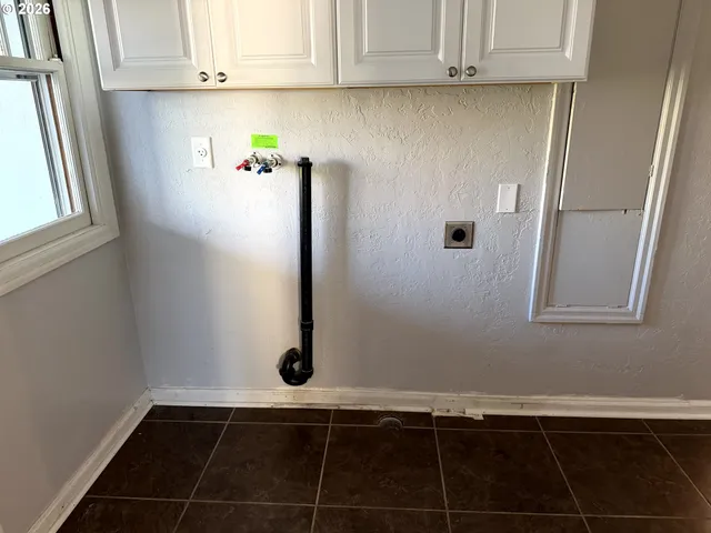 a close view of a utility room with washer and dryer